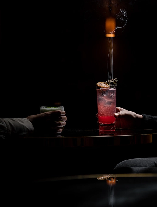 Couple toasting their wedding anniversary at the Dans le Noir ? restaurant